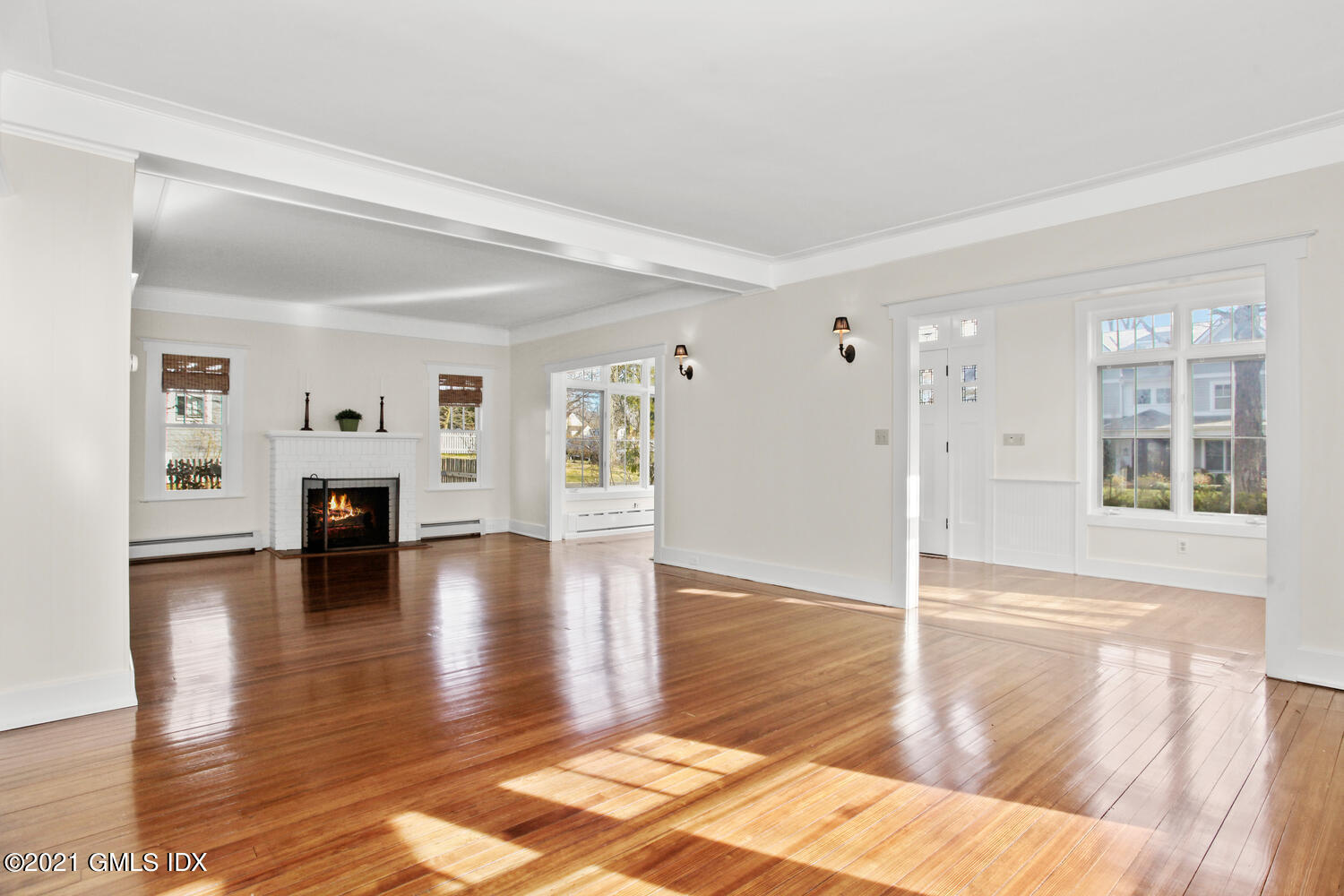 11 Chapel Lane Riverside, CT 06878 - Photo 7 of 33 a view of a living room with hardwood floor and a fireplace
