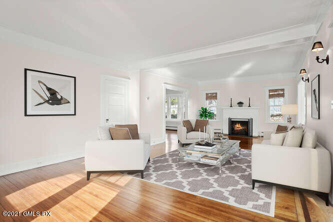 11 Chapel Lane Riverside, CT 06878 - Photo 8 of 33 a living room with furniture and a fireplace