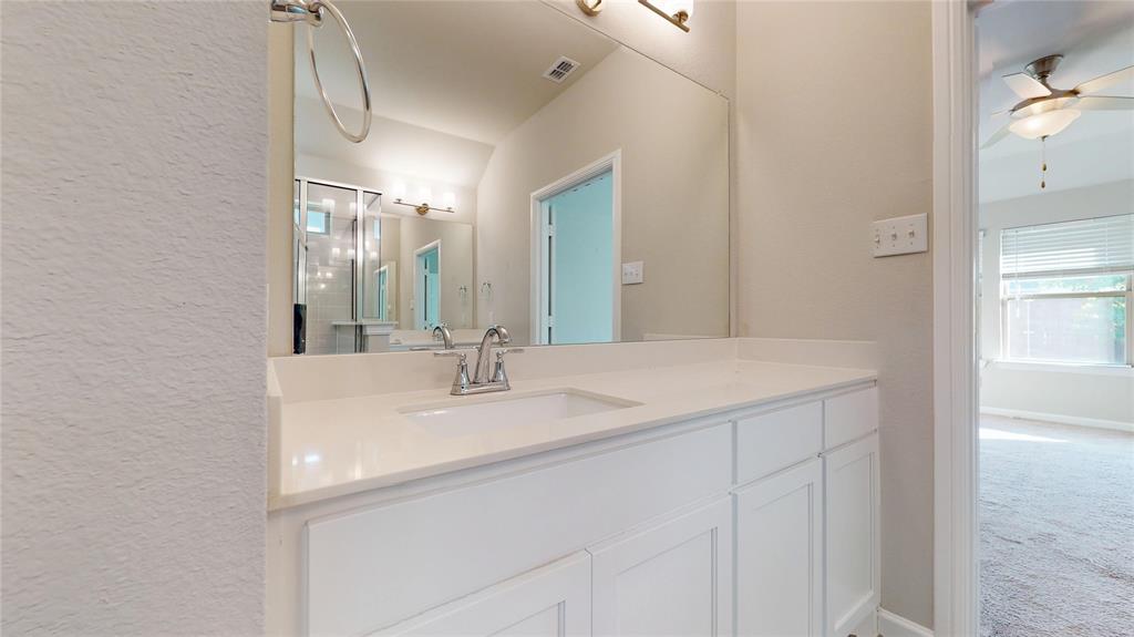 603 Cherry Hill Road Red Oak, TX 75154 - Photo 21 of 32 a bathroom with a sink and a mirror