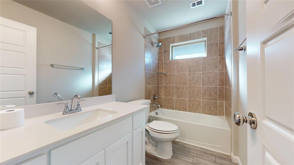 603 Cherry Hill Road Red Oak, TX 75154 - Photo 23 of 32 a bathroom with a sink a toilet and shower