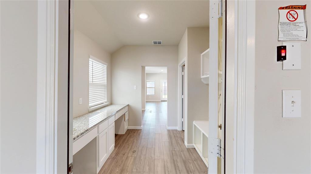 603 Cherry Hill Road Red Oak, TX 75154 - Photo 25 of 32 a view of a hallway with wooden floor and windows