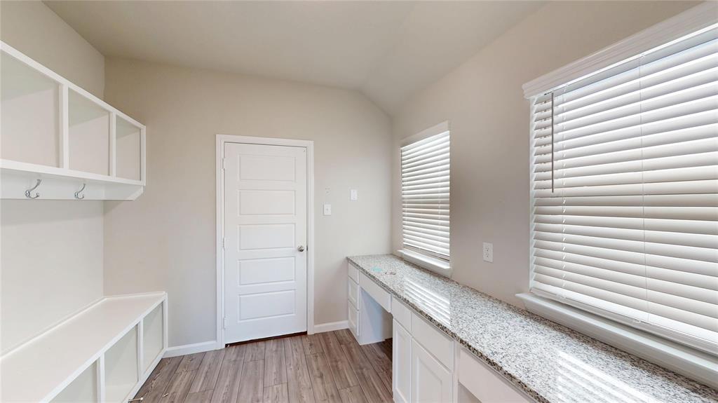 603 Cherry Hill Road Red Oak, TX 75154 - Photo 26 of 32 a view of a kitchen with wooden floor and cabinets