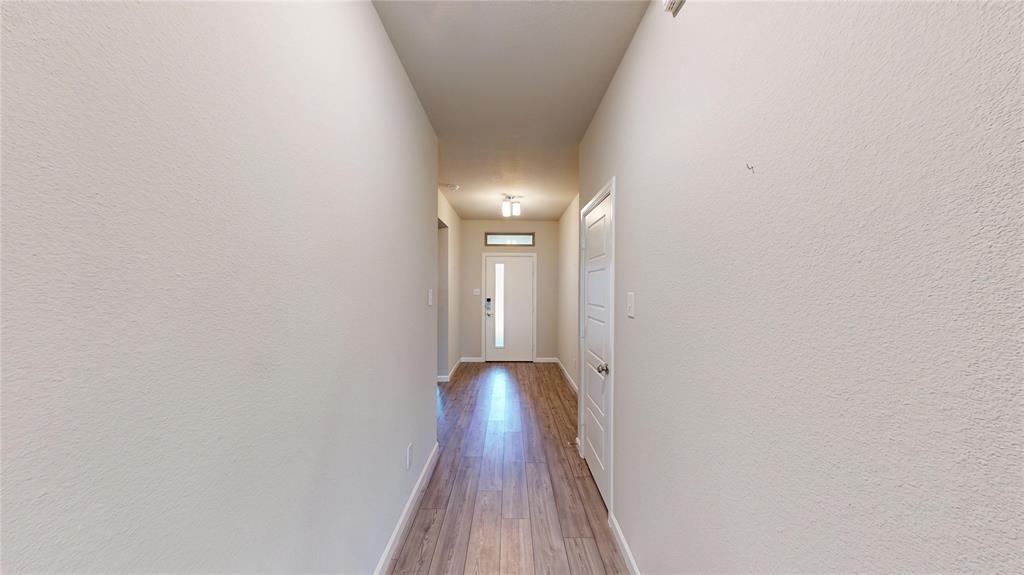 603 Cherry Hill Road Red Oak, TX 75154 - Photo 30 of 32 a view of a hallway with wooden floor