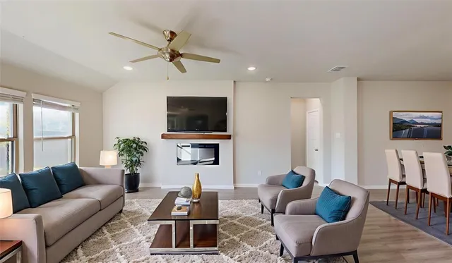 a living room with furniture and a flat screen tv
