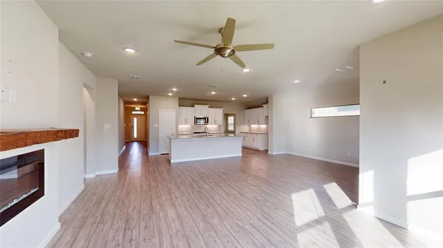 a view of a kitchen with a sink and a stove top oven