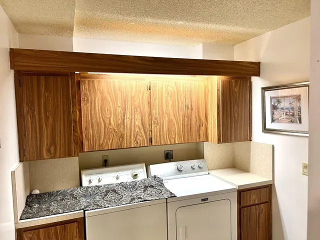 a living room with hard wood flooring and a table