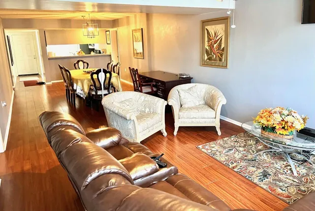 a living room with furniture and a table