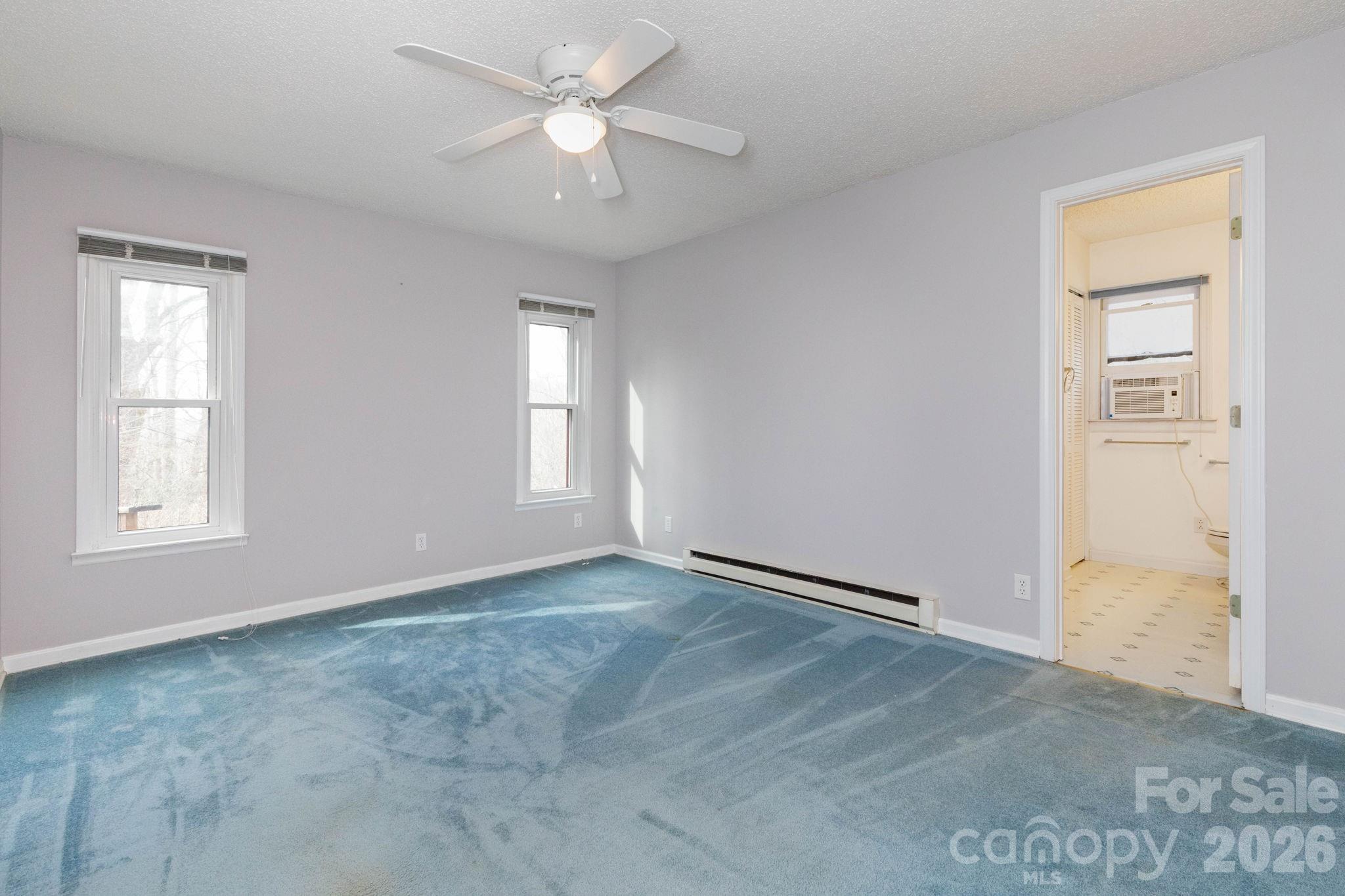 341 Sugar Hollow Road Fairview, NC 28730 - Photo 14 of 24 a view of an empty room with a window