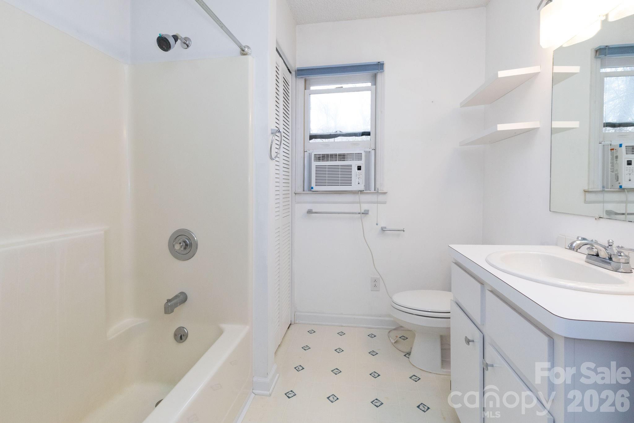 341 Sugar Hollow Road Fairview, NC 28730 - Photo 15 of 24 a bathroom with a sink toilet and shower