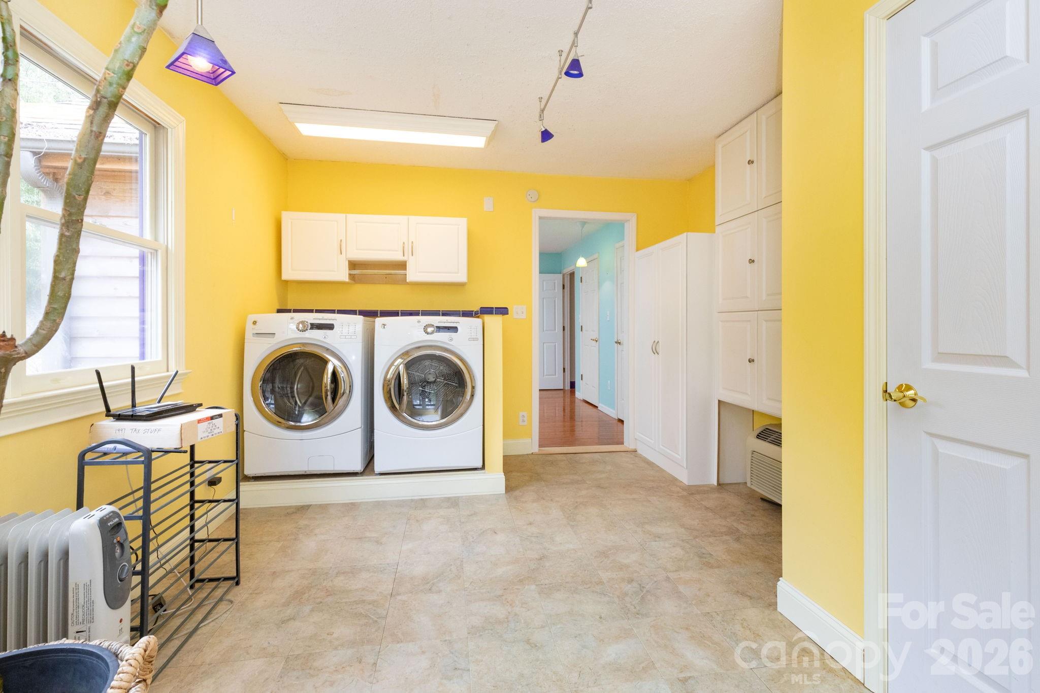 341 Sugar Hollow Road Fairview, NC 28730 - Photo 16 of 24 a utility room with dryer and washer