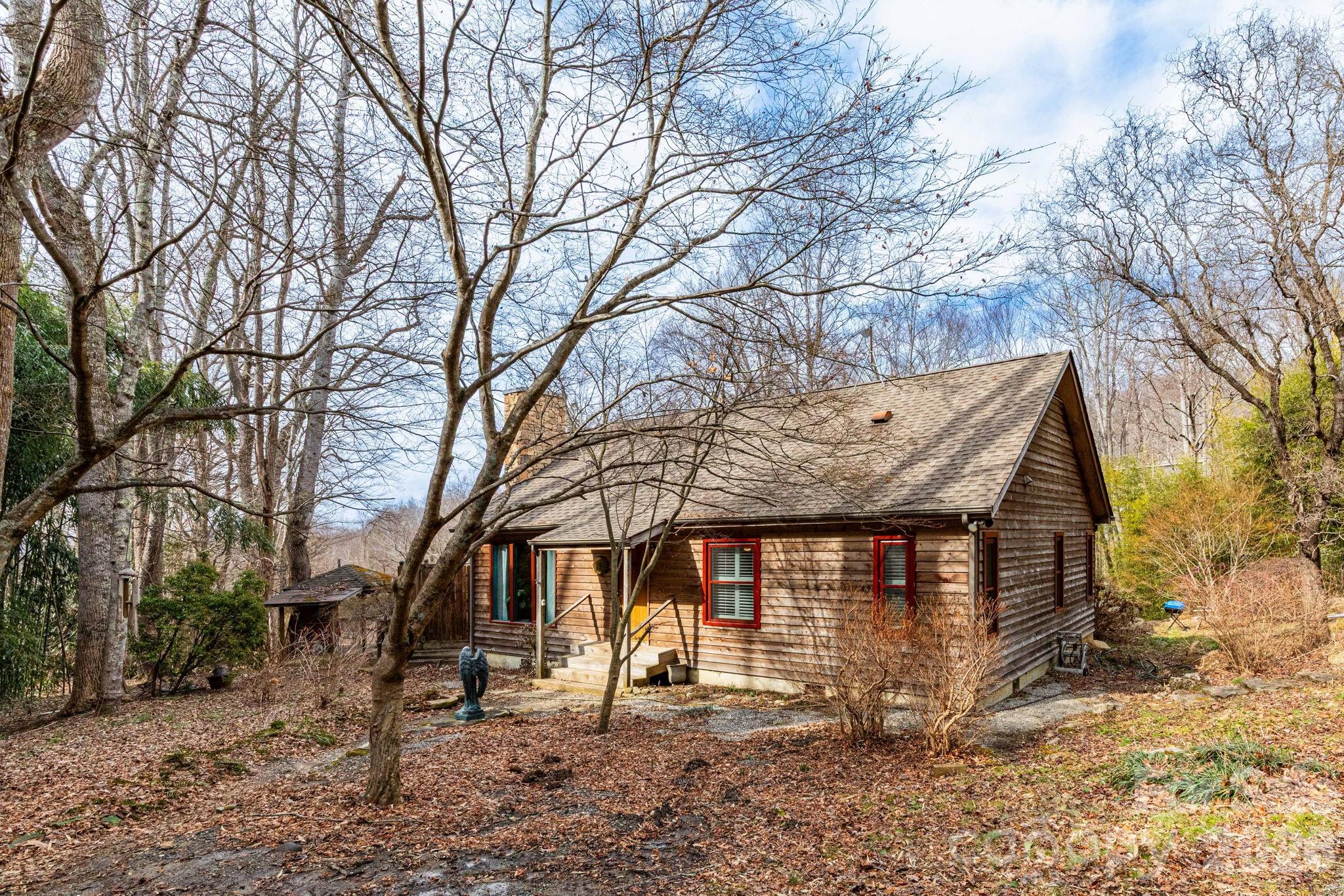 341 Sugar Hollow Road Fairview, NC 28730 - Photo 3 of 24 a view of a house with a yard