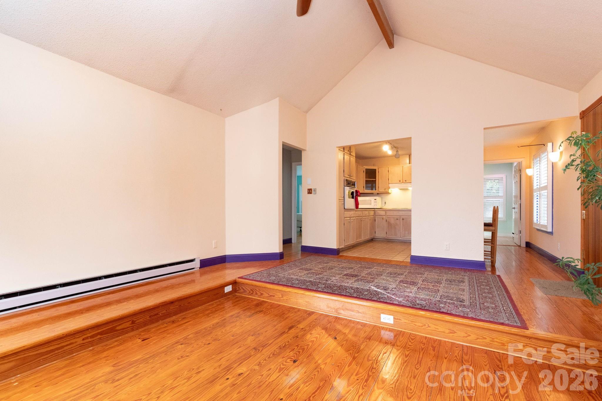 341 Sugar Hollow Road Fairview, NC 28730 - Photo 7 of 24 a view of empty room with wooden floor