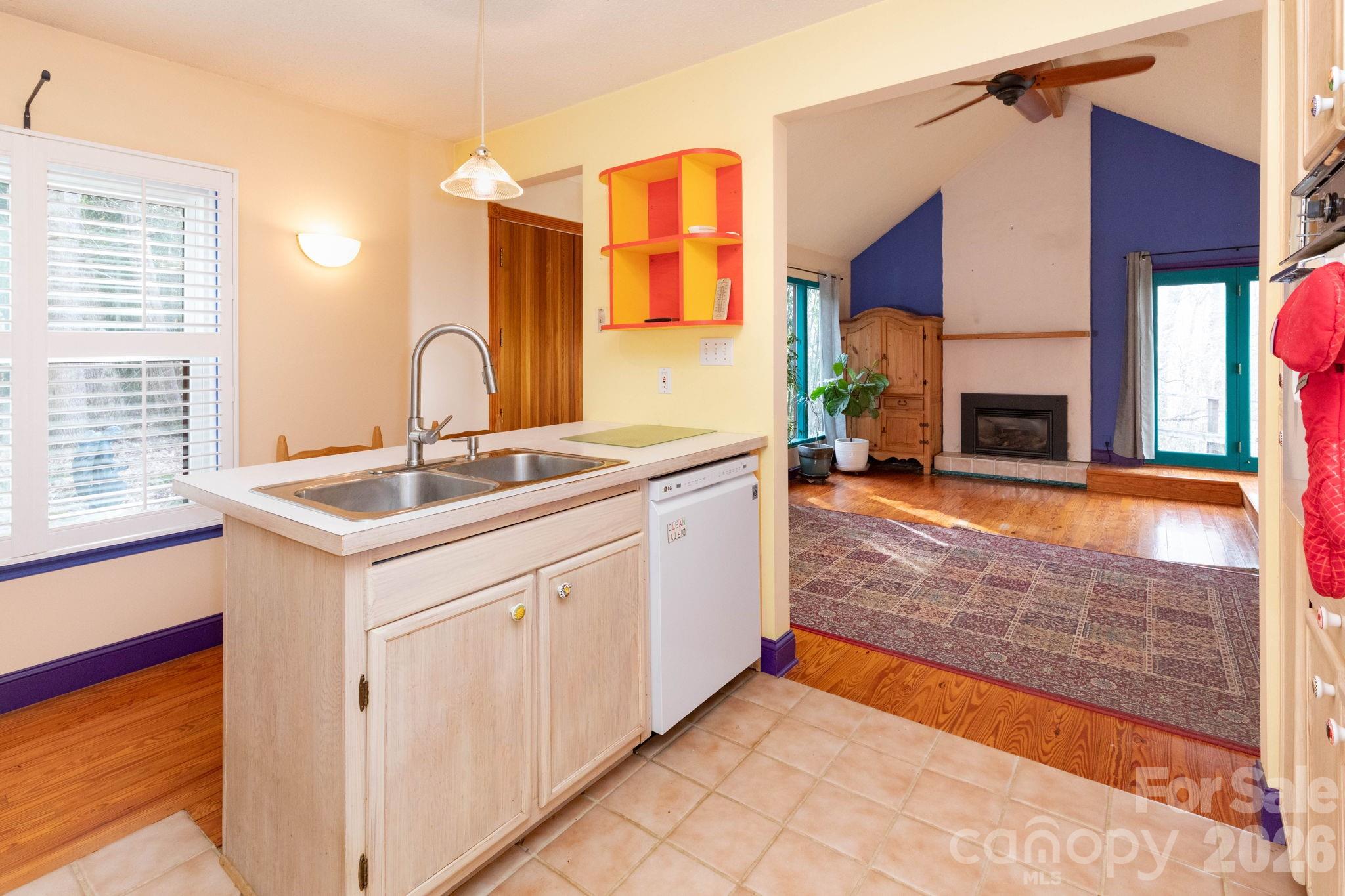 341 Sugar Hollow Road Fairview, NC 28730 - Photo 9 of 24 a kitchen with a sink stove and refrigerator