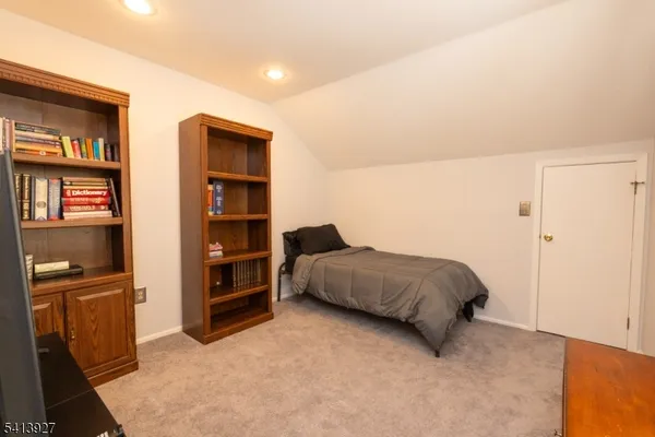 a bedroom with a bed and furniture