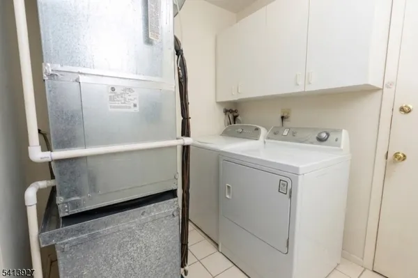a utility room with cabinets