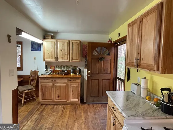 a kitchen with stainless steel appliances granite countertop a stove and a refrigerator