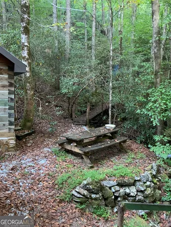 a view of a backyard of the house