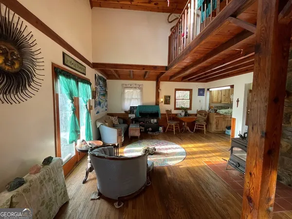 a kitchen with granite countertop a sink stove and refrigerator