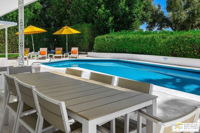 a view of a house with swimming pool
