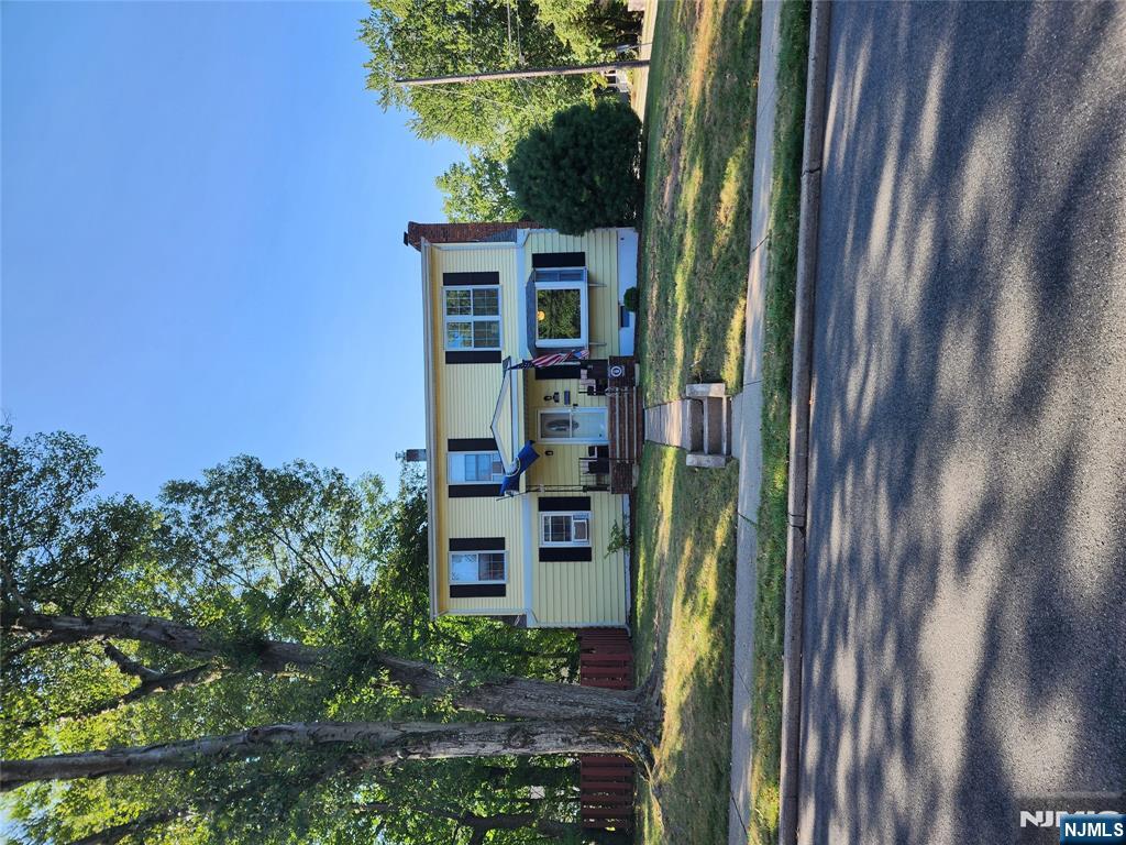 a view of a house with a big yard