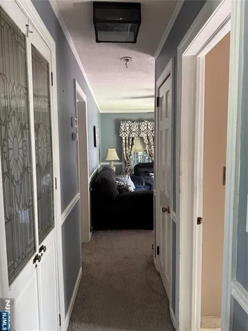 a living room with furniture and a gate