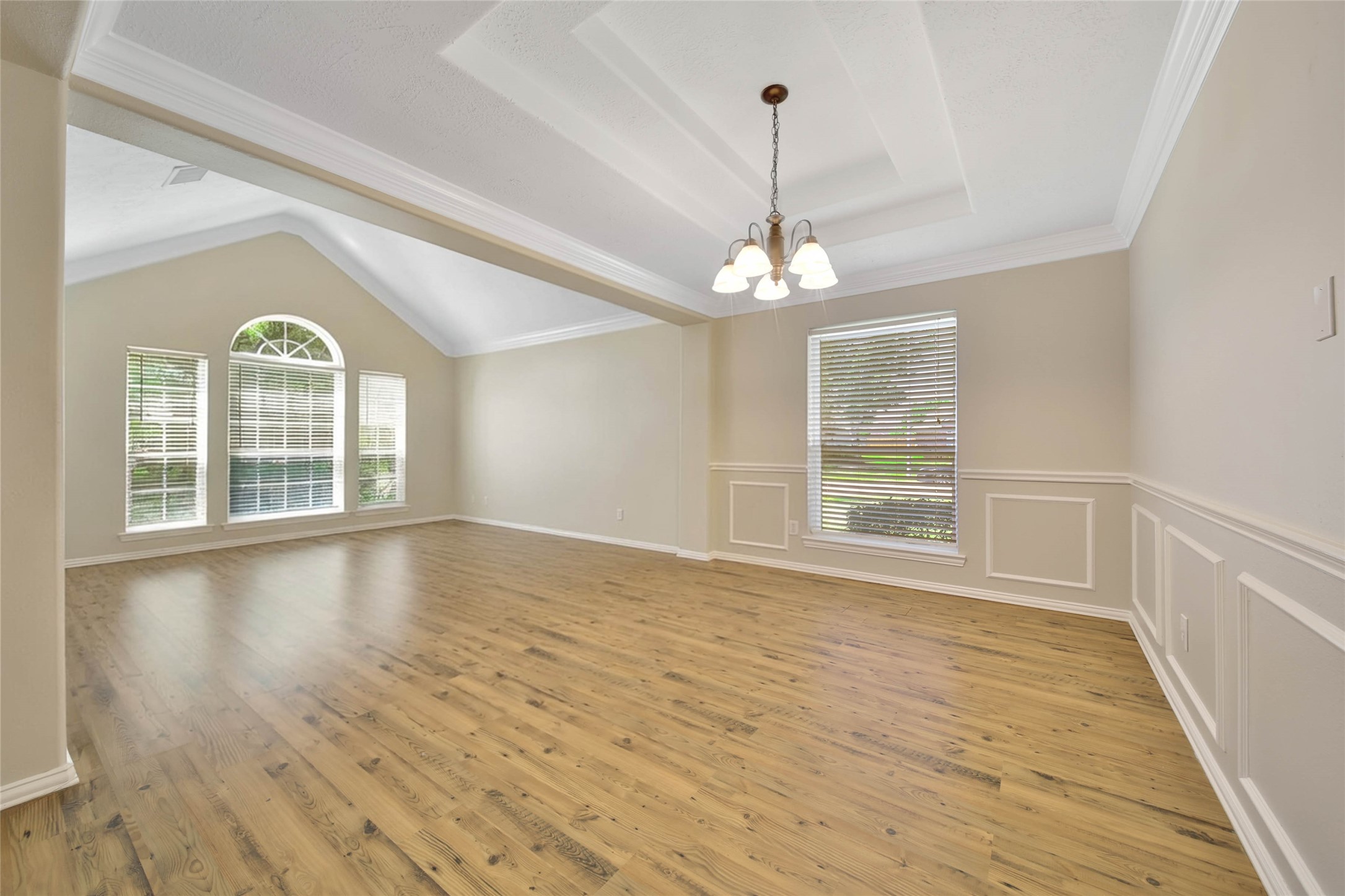21338 Timber Pines Drive Spring, TX 77388 - Photo 7 of 29 a view of an empty room with wooden floor and a window