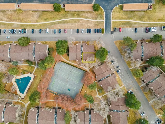 an aerial view of houses with outdoor space