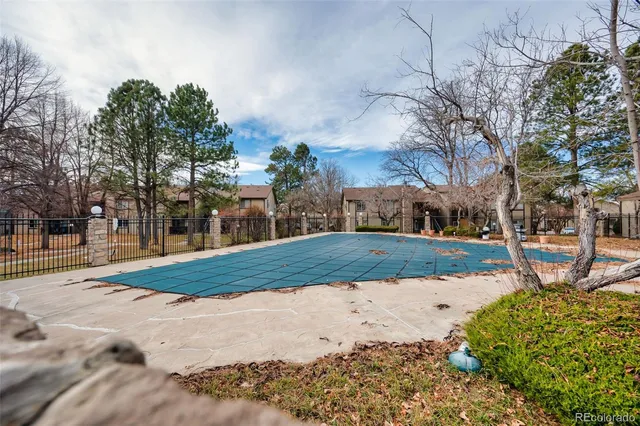 front view of a house with a tree