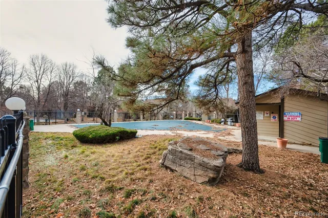 a view of wooden fence and a pathway