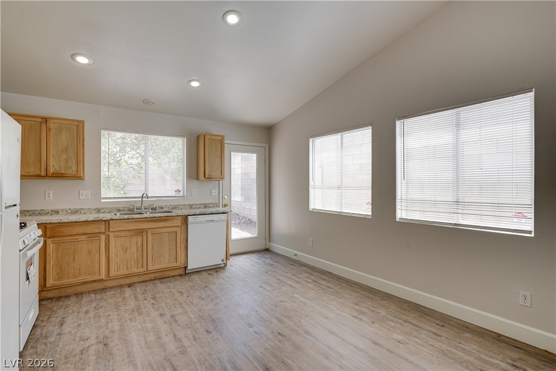 9660 Crystal Ridge Road Las Vegas, NV 89123 - Photo 11 of 13 Bright and open, this kitchen offers ample counter space and convenient access to outdoor living.