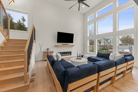 a living room with fireplace furniture and a flat screen tv