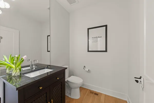 a bathroom with a double vanity sink mirror and bathtub