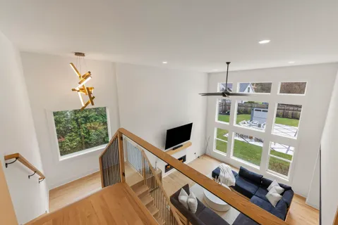 a bathroom with a double vanity sink mirror and bathtub