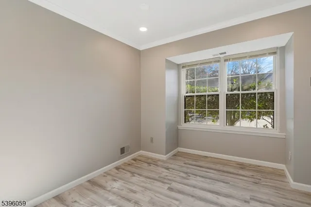 a bathroom with a sink vanity and shower