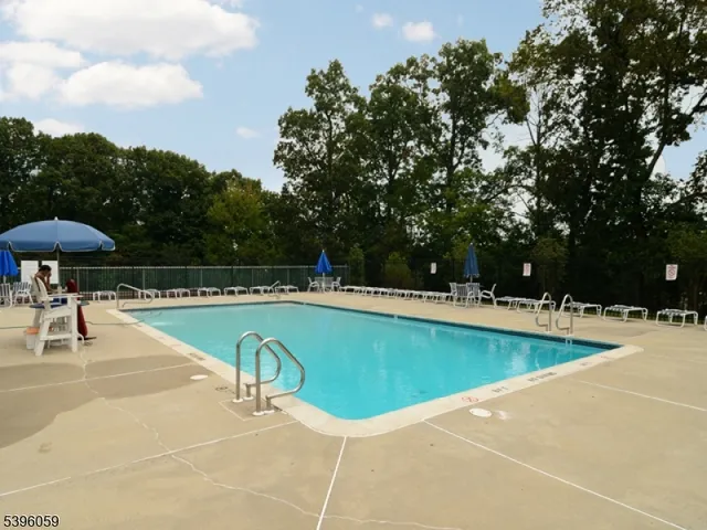 a backyard of a house with barbeque oven and outdoor seating