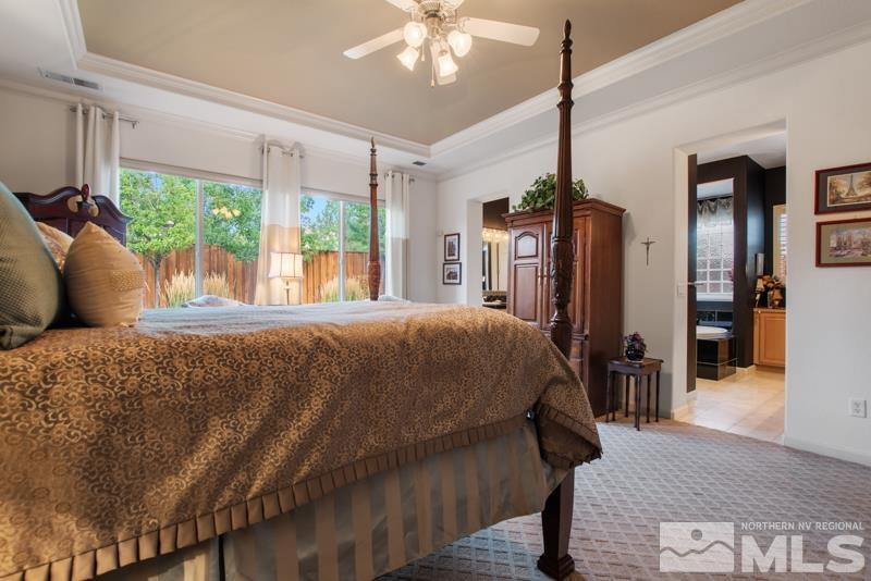 9900 Bridgeview Court Reno, NV 89521 - Photo 20 of 31 a bed sitting in a spacious bedroom next to a window