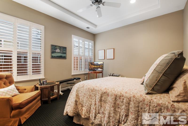 9900 Bridgeview Court Reno, NV 89521 - Photo 24 of 31 a bedroom with a bed and a couch