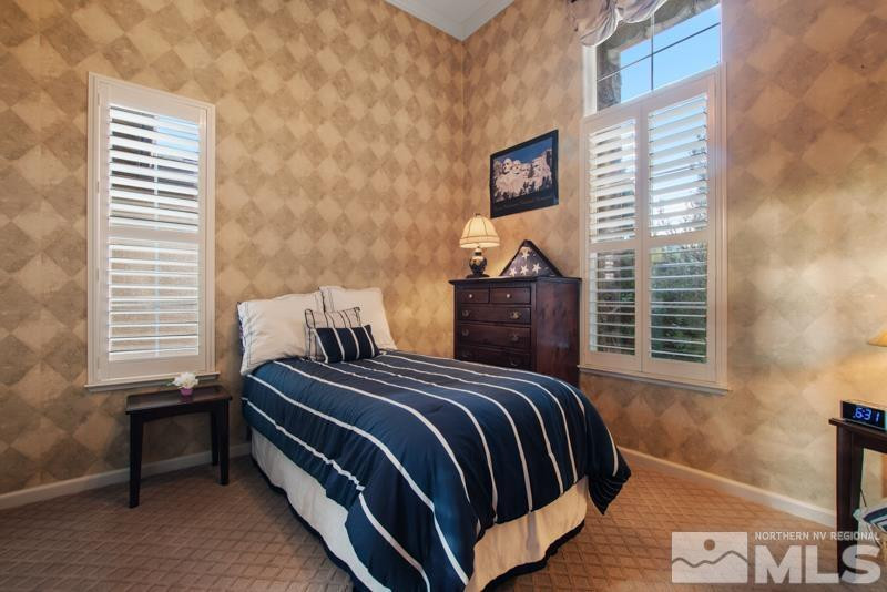 9900 Bridgeview Court Reno, NV 89521 - Photo 25 of 31 a bedroom with a bed and wooden floor