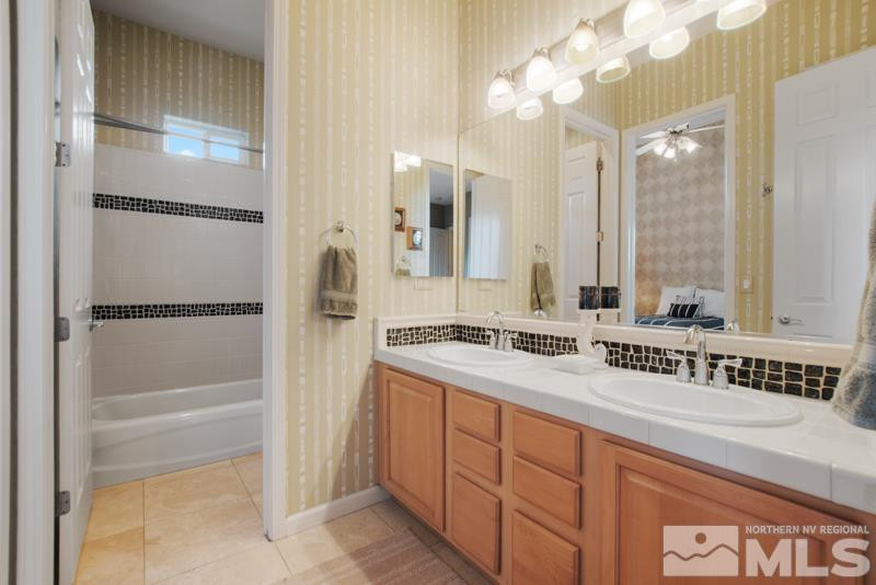 9900 Bridgeview Court Reno, NV 89521 - Photo 26 of 31 a bathroom with a sink and a mirror