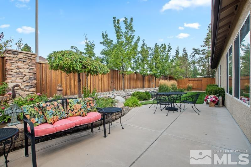 9900 Bridgeview Court Reno, NV 89521 - Photo 28 of 31 a view of a chairs and table in the back yard of the house