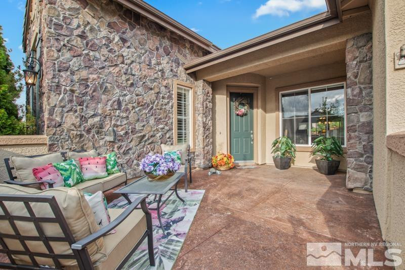 9900 Bridgeview Court Reno, NV 89521 - Photo 3 of 31 a front view of a house with outdoor seating