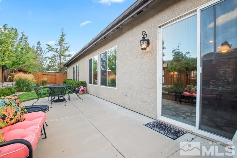 9900 Bridgeview Court Reno, NV 89521 - Photo 31 of 31 a backyard of a house with outdoor seating and plants