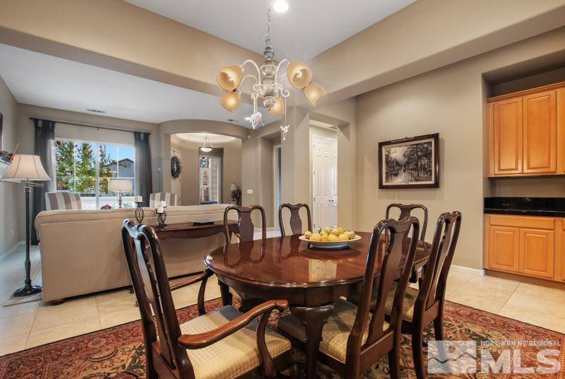 9900 Bridgeview Court Reno, NV 89521 - Photo 7 of 31 a view of a dining room with furniture and chandelier