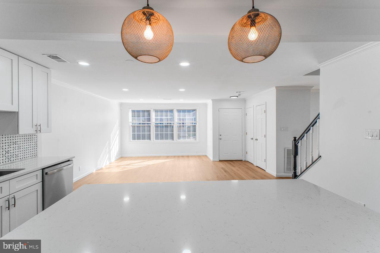 4047 Chetham Way Woodbridge, VA 22192 - Photo 13 of 55 a view of an empty room with wooden floor and a window