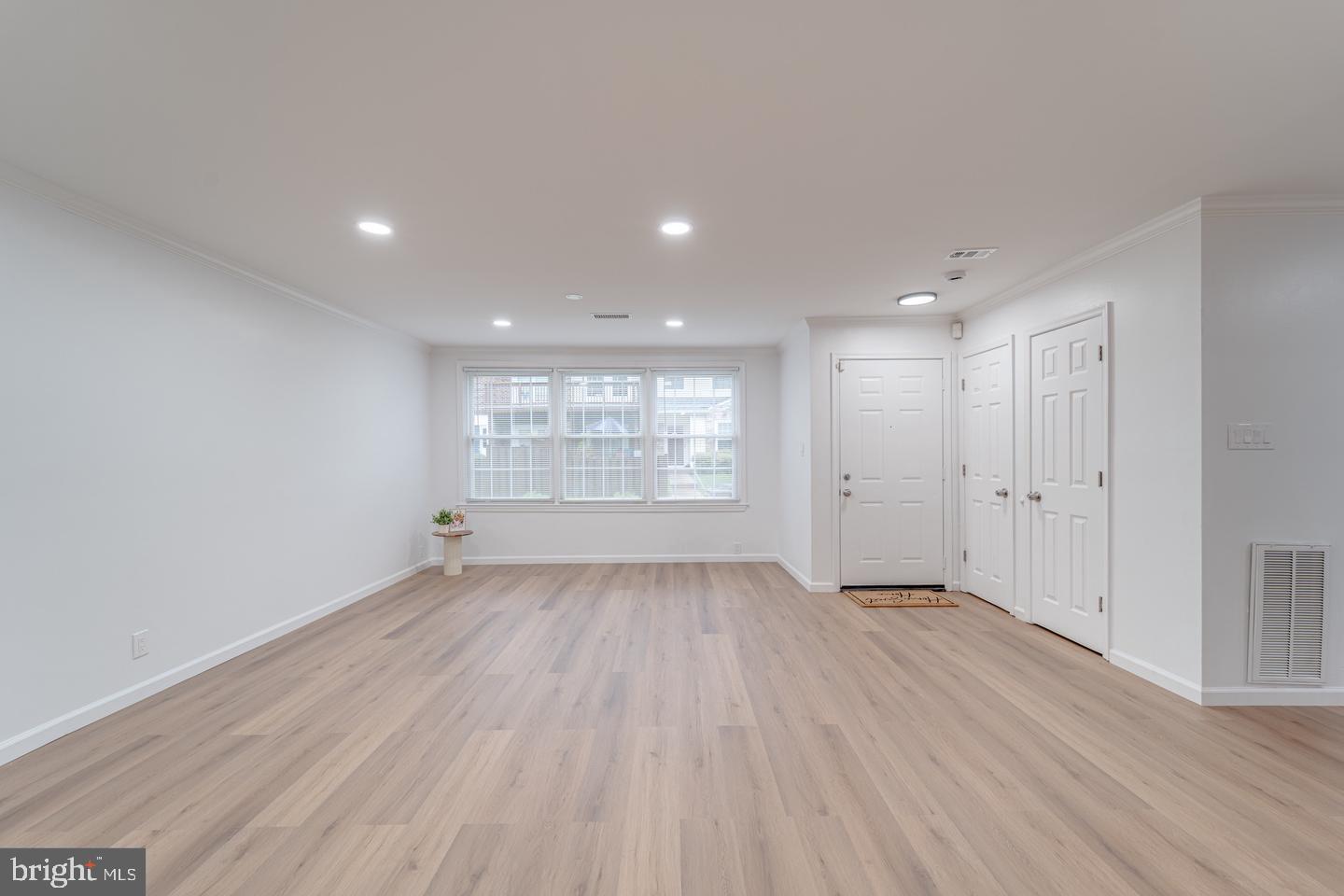 4047 Chetham Way Woodbridge, VA 22192 - Photo 17 of 55 a view of an empty room with wooden floor and window