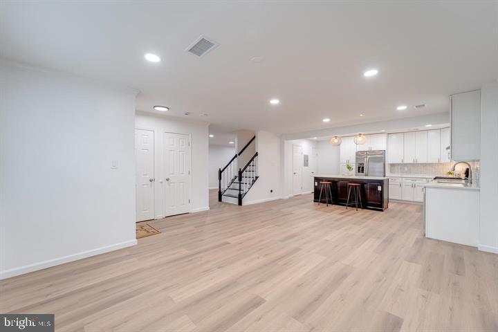 4047 Chetham Way Woodbridge, VA 22192 - Photo 18 of 55 a view of kitchen with kitchen island sink and center island