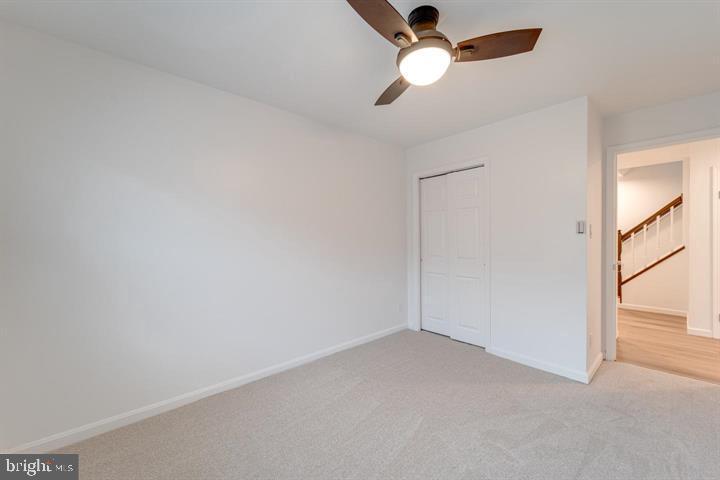 4047 Chetham Way Woodbridge, VA 22192 - Photo 25 of 55 an empty room with a window and a fan