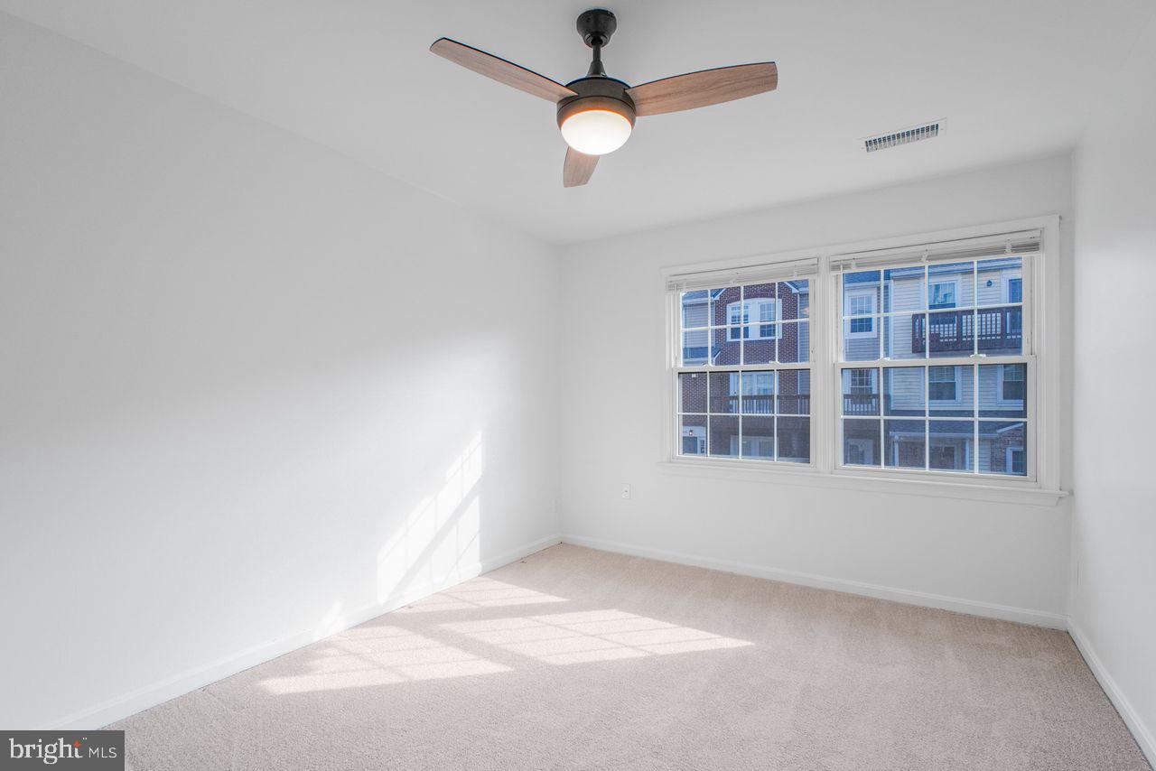 4047 Chetham Way Woodbridge, VA 22192 - Photo 26 of 55 an empty room with cabinet and windows