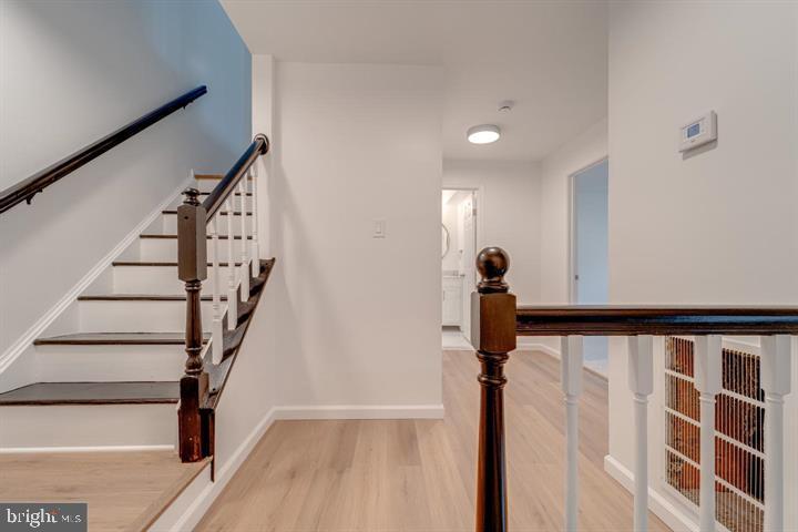 4047 Chetham Way Woodbridge, VA 22192 - Photo 29 of 55 a view of a hallway with wooden floor and staircase