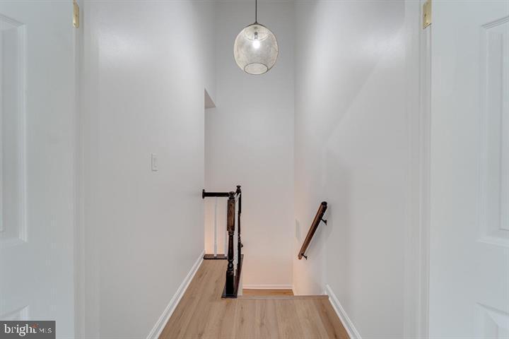 4047 Chetham Way Woodbridge, VA 22192 - Photo 31 of 55 a view of a hallway with wooden floor and staircase